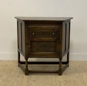 An oak creedence or hall cabinet of 17th century design, fitted with two drawers above a lozenge