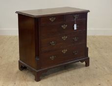 A George III mahogany chest, fitted with two short and three long graduated and cock beaded drawers,