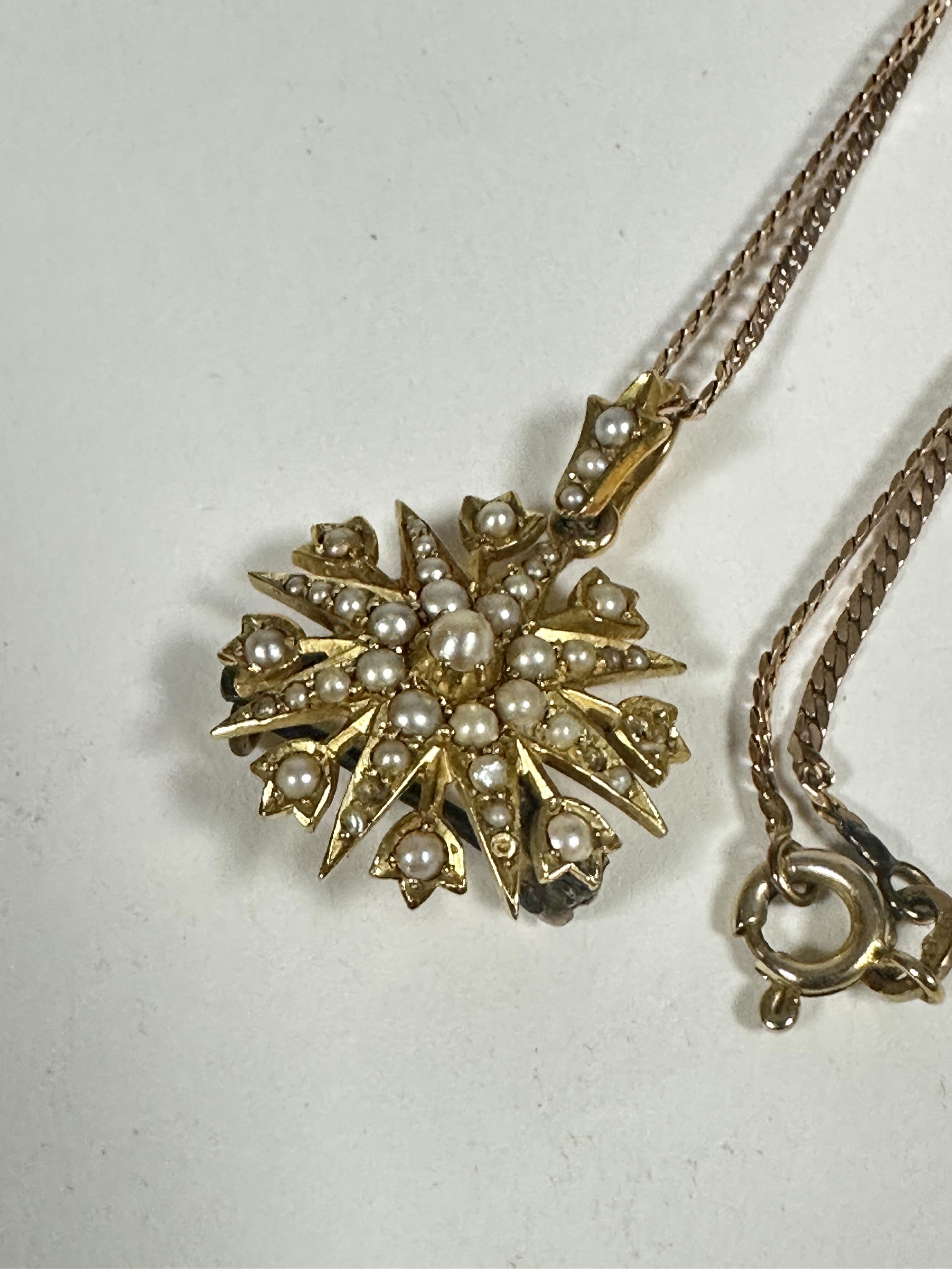 An Edwardian yellow metal sunburst style pendant set seed pearls with loop to top and later pin - Image 2 of 3