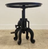 An unusual Industrial style cast iron lamp or bistro table, the circular revolving top above a
