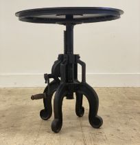 An unusual Industrial style cast iron lamp or bistro table, the circular revolving top above a