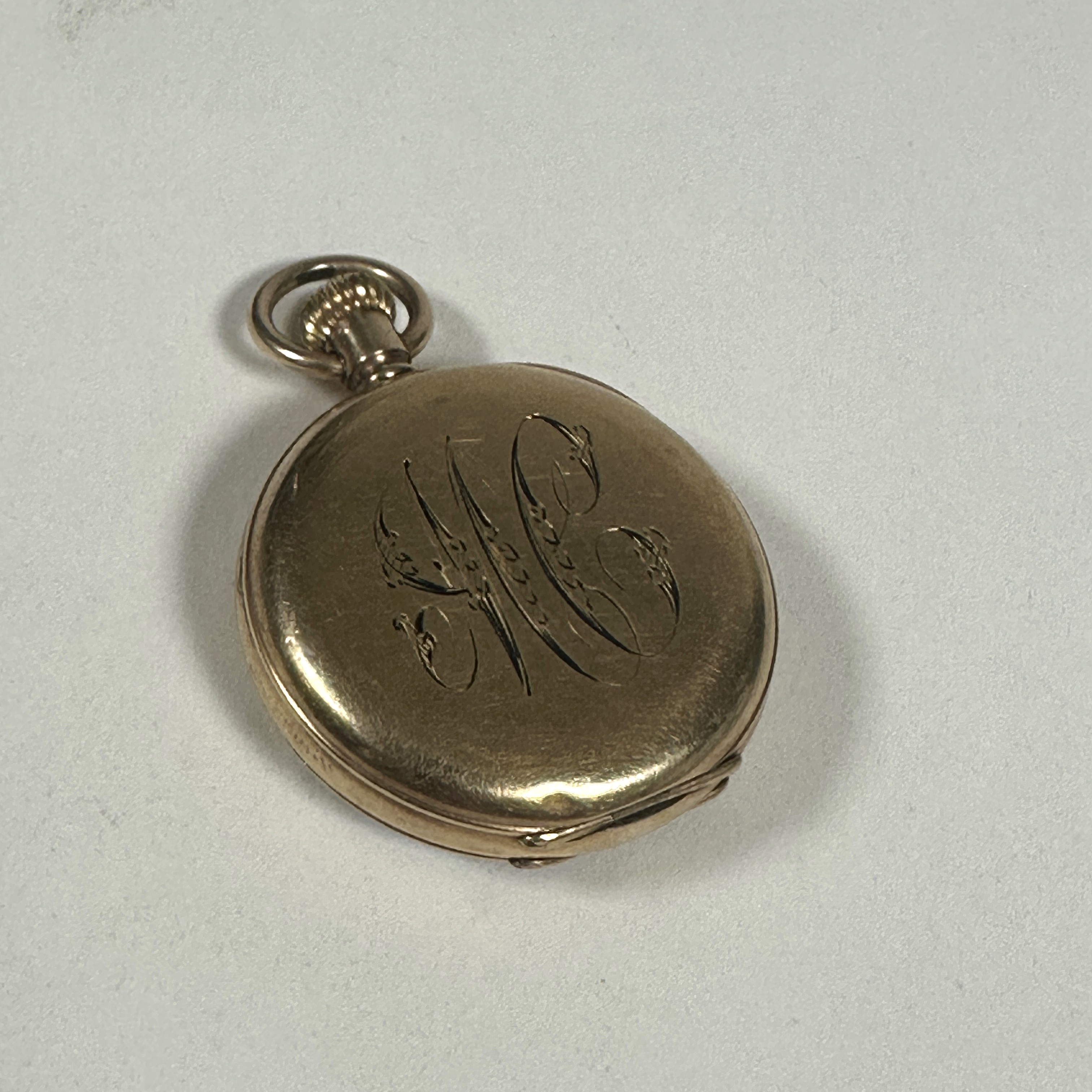 A Lady's gold plated Waltham of Massachusetts USA open face fob watch with white enamel dial and - Image 3 of 3