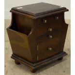 A late 20th century stained walnut chest, fitted with four drawers and a magazine rack to each end