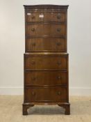 A Georgian style mahogany serpentine chest on chest, fitted with six long graduated drawers,