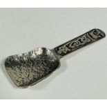 A Scottish Celtic Art Industries Iona Sterling Silver caddy spoon with cast Celtic knot, boat and