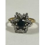 A 18ct gold Sapphire and Diamond cluster ring of star design, the oval Sapphire approximately 0.