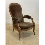 A late 19th century walnut framed spoon back open armchair, the reclining back, arms and seat