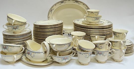 A large Royal Doulton 'Juliet' gilt dinner service decorated with flora sprays comprising twenty