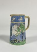 A 1920's ceramic pitcher, handpainted decoration of a landscape scene and white sparrow to rim. (C.