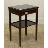 A Georgian style inlaid mahogany side table, with plate glass top above frieze drawer, raised on