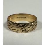 A yellow metal wedding band with internal inscription Martie 3-5-18, O. 4.12g