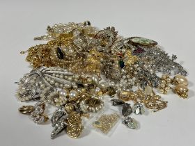 A collection of Vintage costume jewellery including paste pearls, gilt metal chains, paste pearl and