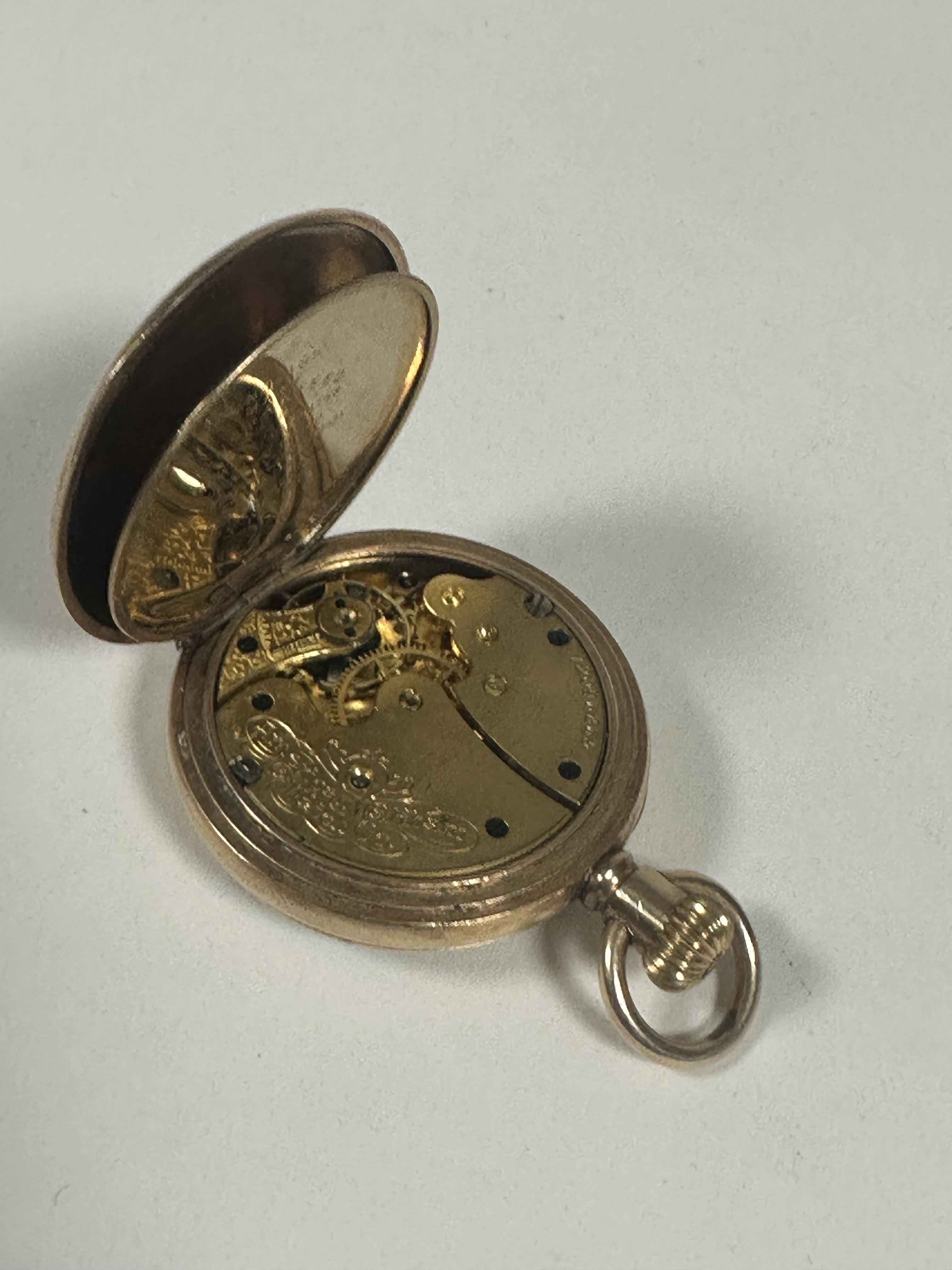 A Lady's gold plated Waltham of Massachusetts USA open face fob watch with white enamel dial and - Image 2 of 3