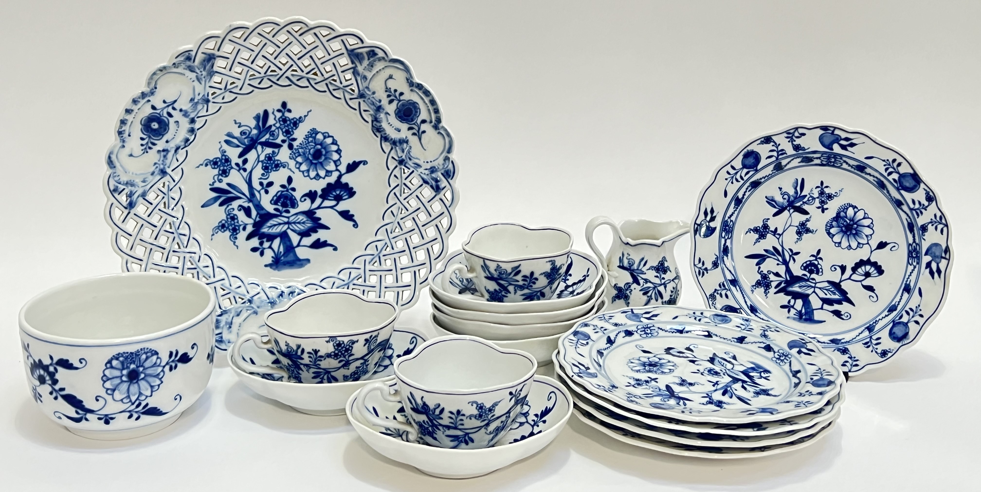A group of Meissen porcelain blue onion blue pattern items comprising three cups, six saucers (w-