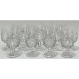 A group of thistle-form cut crystal drinking glasses comprising seven brandy glasses (h- 11.5cm),