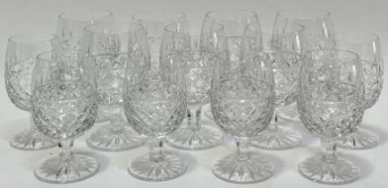 A group of thistle-form cut crystal drinking glasses comprising seven brandy glasses (h- 11.5cm),