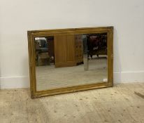 A gilt composition framed wall hanging mirror in the Rococo taste 104cm x 74cm