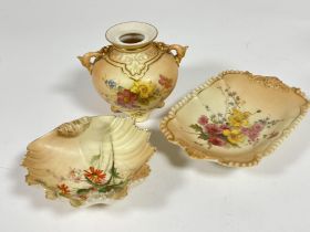 A group of three Royal Worcester blush ware porcelain including a ovoid jar with twin handles to