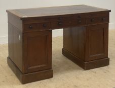 A Victorian mahogany twin pedestal desk, the top inset with tooled oxblood leather writing
