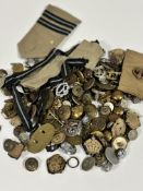 A collection of British badges and buttons including Trans Jordan Frontier Force, REME, RE etc