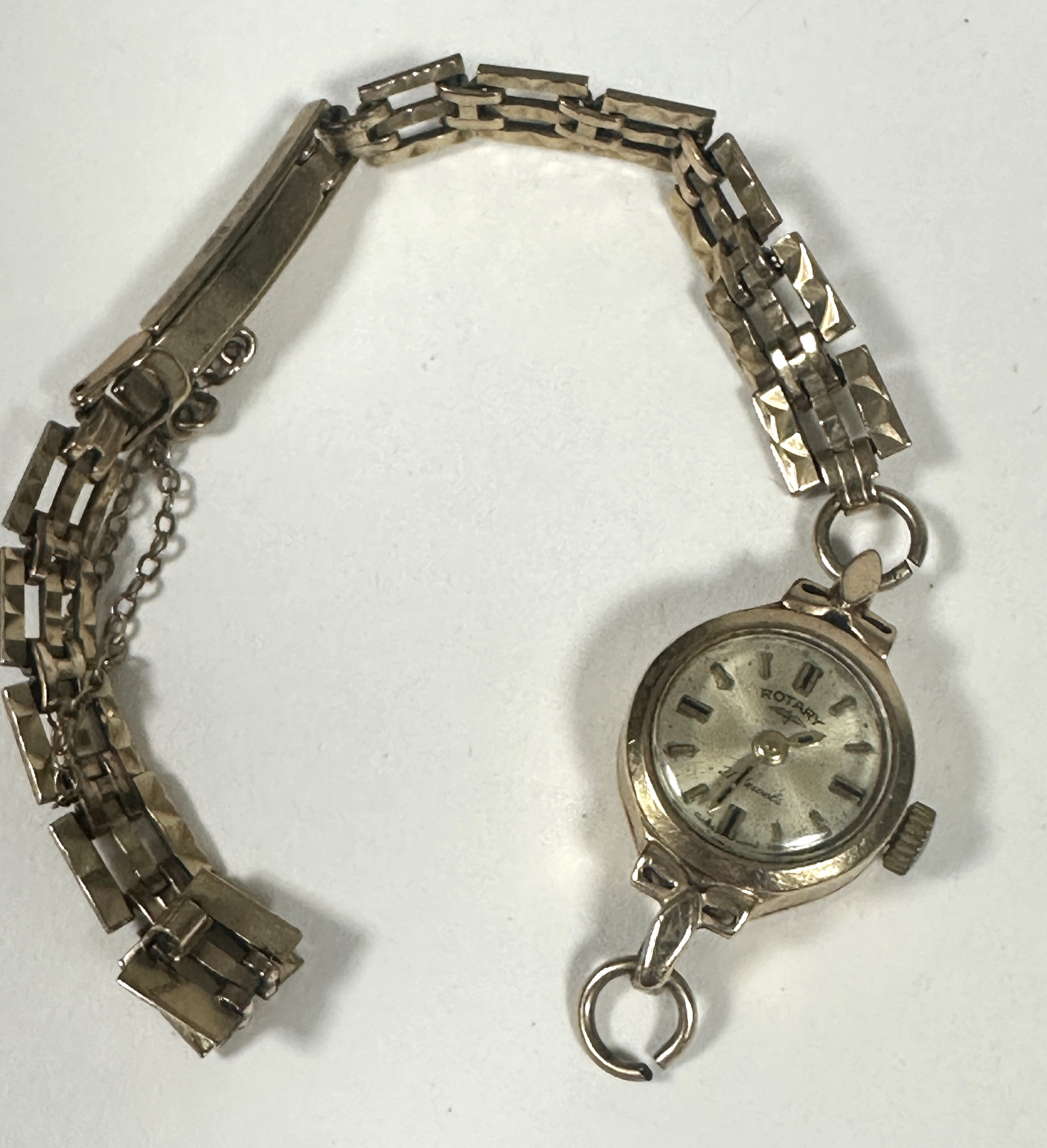 A 9ct gold Lady's Rotary wrist watch, the silvered dial with baton hour markers on 9ct gold gatelink