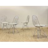 After Charles and Ray Eames, a set of four chrome plated wire dining chairs, with faux white leather