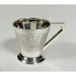 A Birmingham silver Art Deco christening cup of tapered cylindrical form with squared handle to side