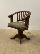 A late 20th century stained hardwood captains style swivel desk chair, H90cm