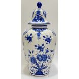 A large blue and white Delft pottery urn decorated with floral design (marked verso 'Der Bleu