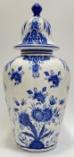 A large blue and white Delft pottery urn decorated with floral design (marked verso 'Der Bleu