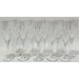 A set of ten cut-crystal glass champagne flutes (h- 23cm)