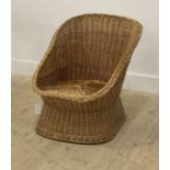 A vintage mid century wicker tub shaped chair, H70cm