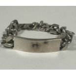 A gents heavy Sterling Silver flat kerb link identity bracelet, uninscribed,(D x 7cm). 94.2g