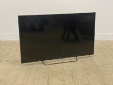 A 50" Sony Bravia flat screen HD TV with power cable and remote (untested)