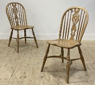 A set of three light ash Windsor chairs, with hoop, spindle and splat back over saddle seat,