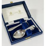 A Mappin & Webb child's spoon and pusher set in original fitted case, in unused condition.