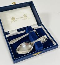 A Mappin & Webb child's spoon and pusher set in original fitted case, in unused condition.