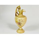 A Edwardian Royal Worcester blush ewer with C scroll handle to side of baluster form decorated