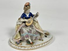 A Capo di Monte porcelain figure " The lute Player " decorated with polychrome enamels, losses to