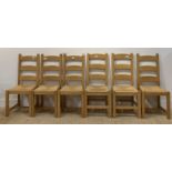 A matched set of six beech framed farmhouse style ladder back dining chairs, with paper cord