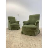 A pair of Victorian easy chairs, upholstered in green geometric chenille raised on turned supports