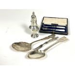 A Birmingham silver dome top sugar caster of baluster form and flame finial on circular base, ( H