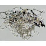A collection of four Chinese cultured pearl multi stand necklaces, a paste pearl and French jet bead