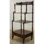 A Victorian mahogany three tier waterfall what not, the top with pierce fret carved gallery,