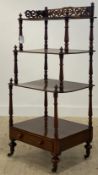 A Victorian mahogany three tier waterfall what not, the top with pierce fret carved gallery,