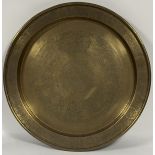 A large brass charger with various Chinese animal scenes to centre and rim. (w-65cm)
