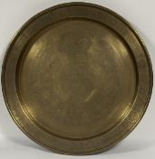A large brass charger with various Chinese animal scenes to centre and rim. (w-65cm)