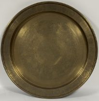 A large brass charger with various Chinese animal scenes to centre and rim. (w-65cm)