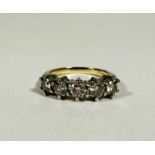 A 18ct gold five stone Diamond ring mounted in white metal claw setting, approximately 1.5ct in