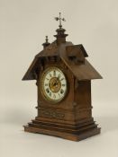 A late 19th century American mantel clock by Ansonia, the gilt brass mounted walnut case of